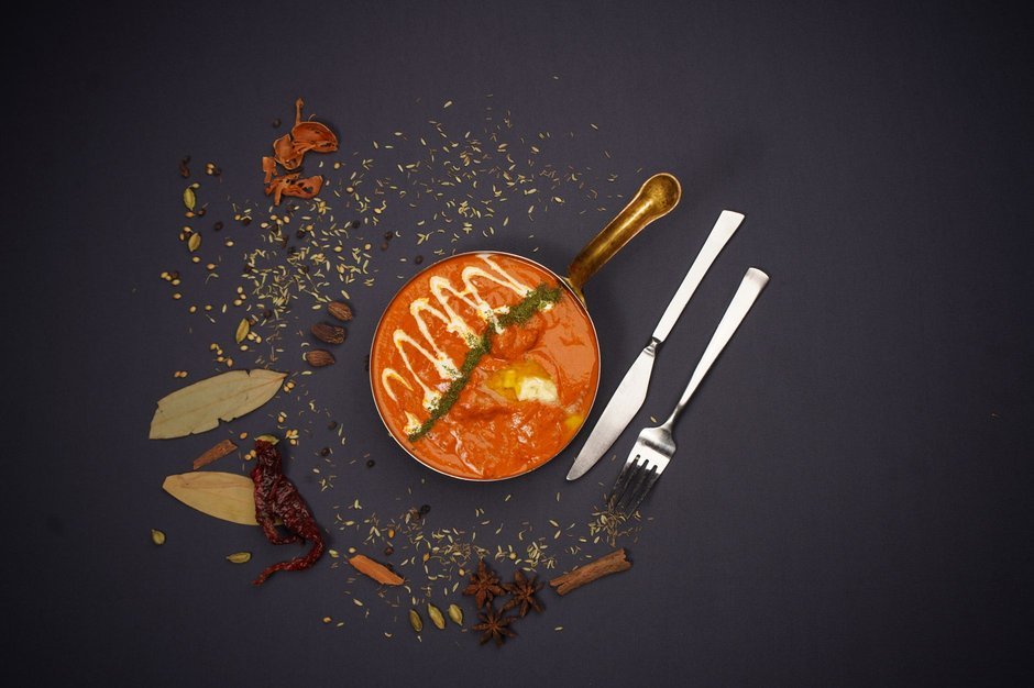 Rich tomato-based makhani curry in a pan