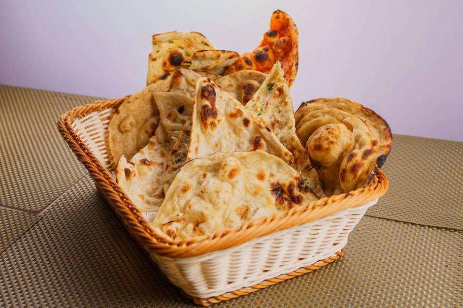 Assorted Indian flatbreads like naan and roti