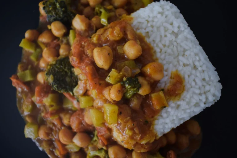 Creamy coconut chickpea and sweet potato curry in a bowl with rice